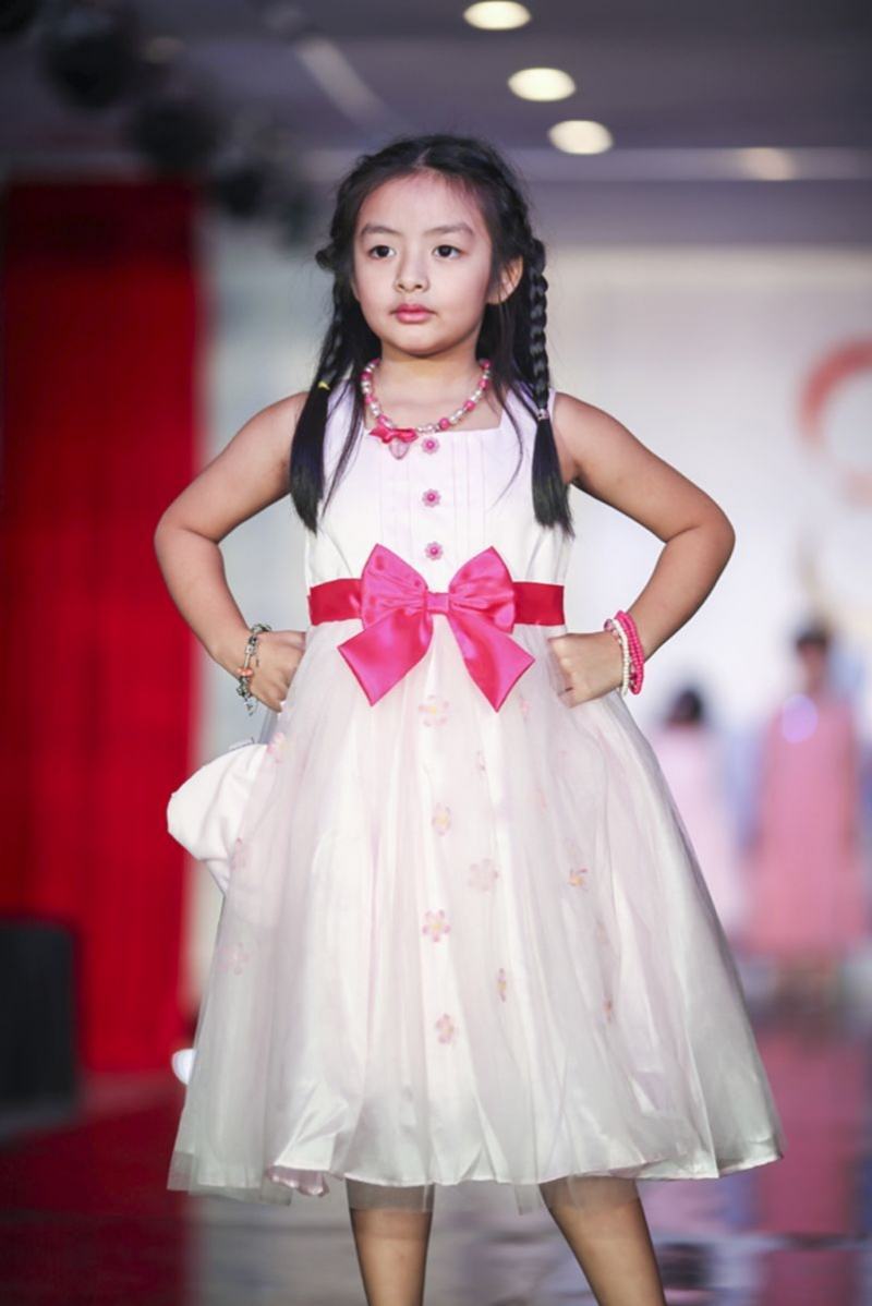 Image of a child model on the catwalk