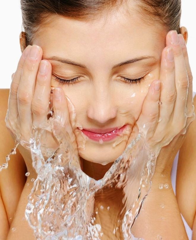 Wash face with warm water