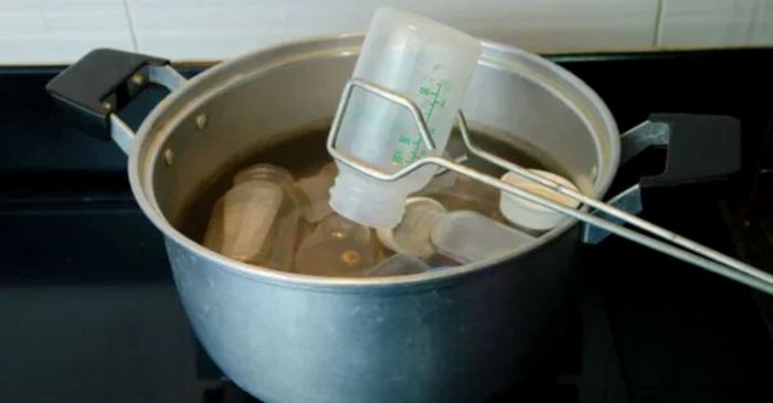 Bring the water to a boil, then drop the milking utensils into the pot of boiling water for about 5 minutes.
