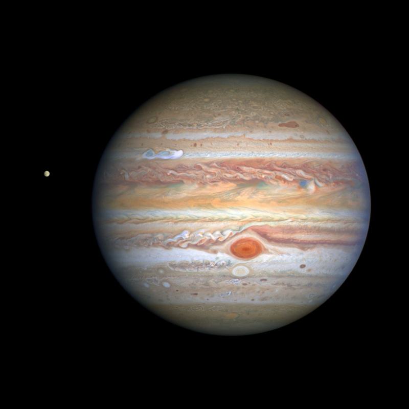 Why does Jupiter have red spots that look like wood grain?