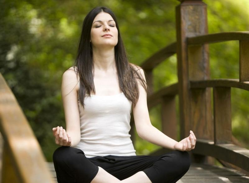 Practicing yoga to improve health, prevent disease