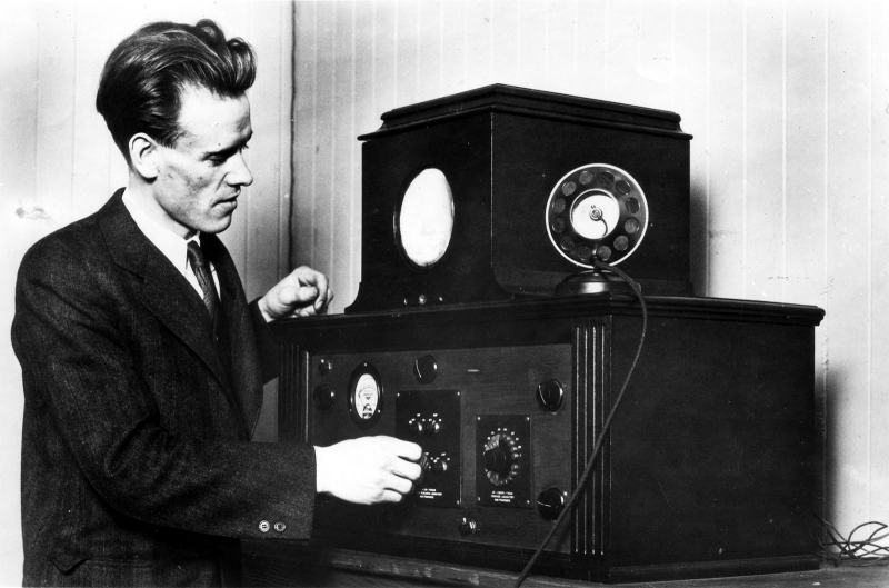Philo T. Farnsworth next to his great invention