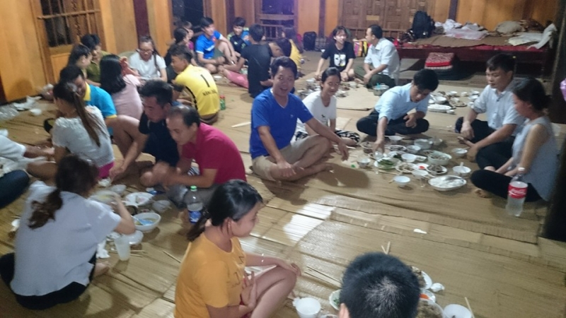 Warm meal together of tourists and locals