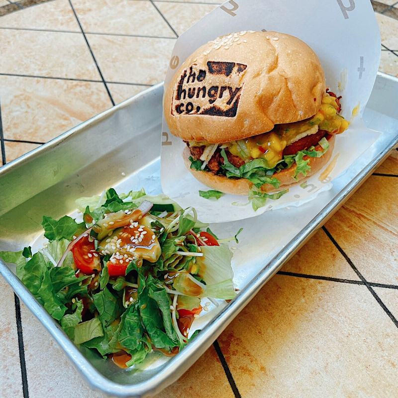 On the side of the burger, there is also a part of the logo of The Hungry Co.