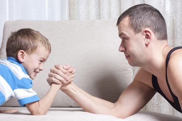Note that when parents play arm wrestling, it should be gentle to avoid hurting children
