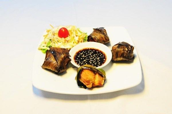 Delicious sticky rice wrapped chicken with special dipping sauce