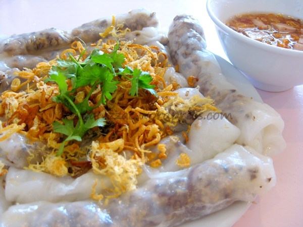 Banh cuon is thinly made by the vendors, inside with a rich layer of meat and cinnamon rolls.