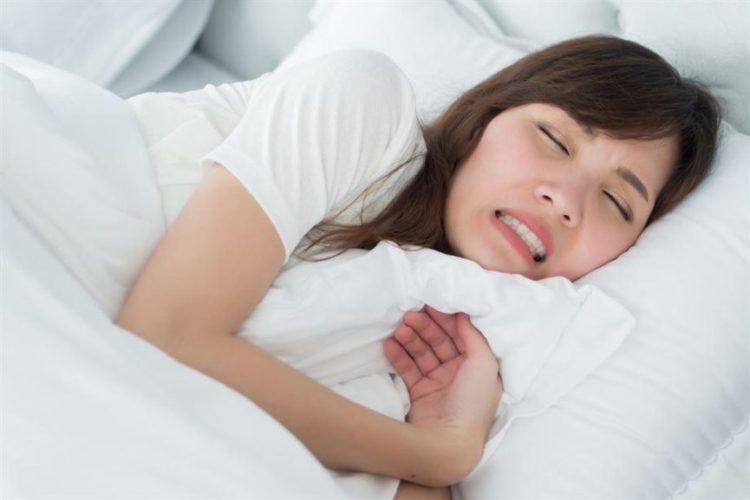 Why do people sleep or grind their teeth?