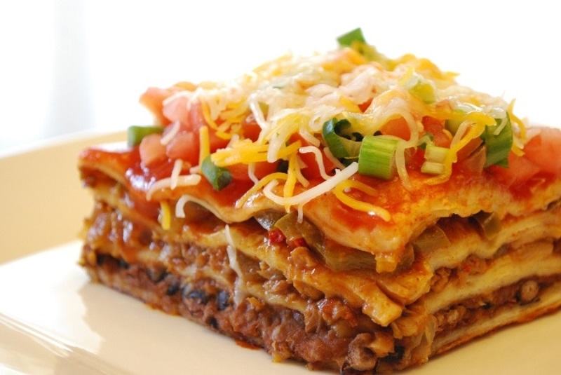Lasagna in Italian is a thin piece of pasta, covered with a tomato sauce with minced meat.