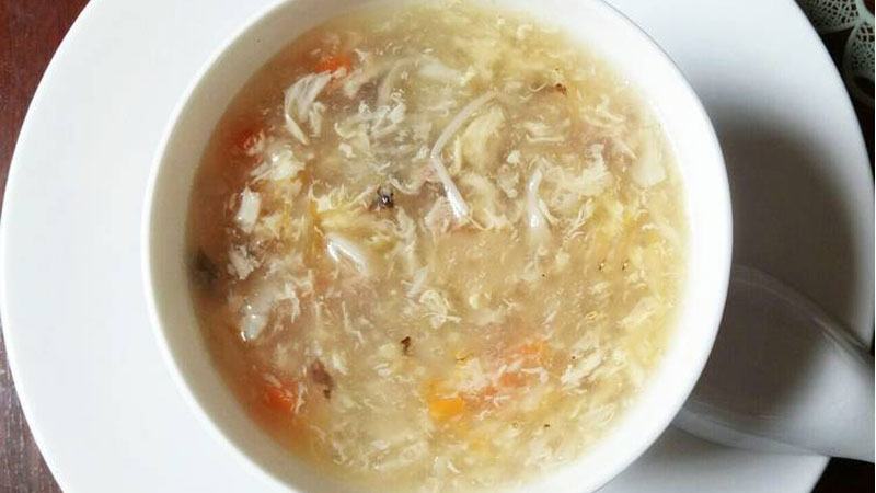 Chicken soup with coconut milk and sausage