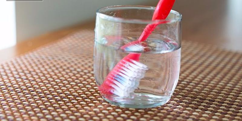 Soak the toothbrush in warm water for a few minutes before brushing