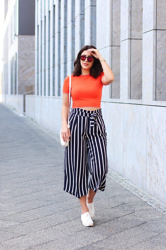 Mix sneakers with culottes/ wide leg pants.